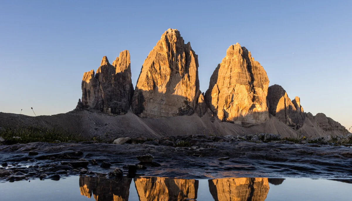 © DAV Teisendorf - Spiegelung der drei Zinnen bei Sonnenaufgang